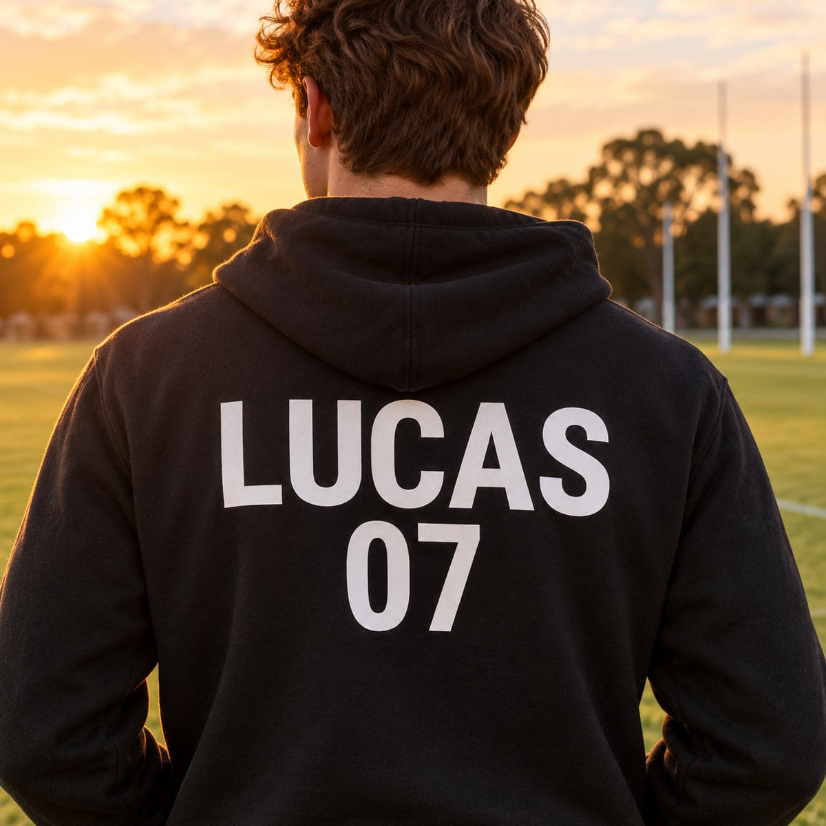White iron-on name and number on the back of a black hoodie