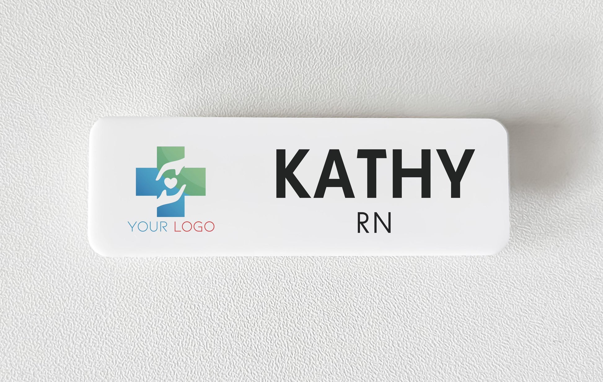 White acrylic name badge with a printed company logo