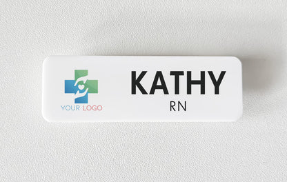 White acrylic name badge with a printed company logo