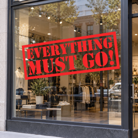 Red Everything Must Go cut vinyl decal displayed on a shop window