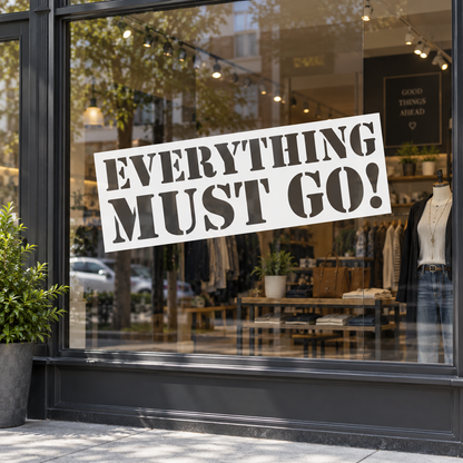 White Everything Must Go window graphic on a retail shopfront