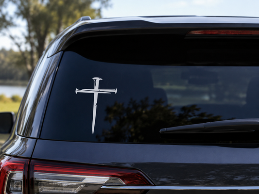 White nail cross vinyl decal on dark car rear window