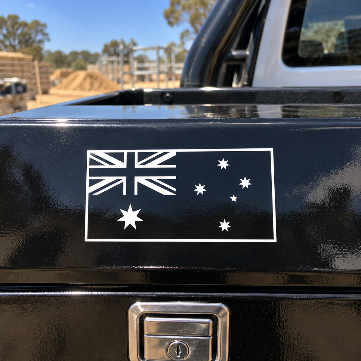 White outline Australian flag decal on a black ute toolbox