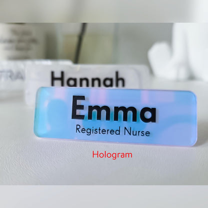 Holographic acrylic name badge – pale blue and pink colour-shift badge reading Emma, Registered Nurse in black