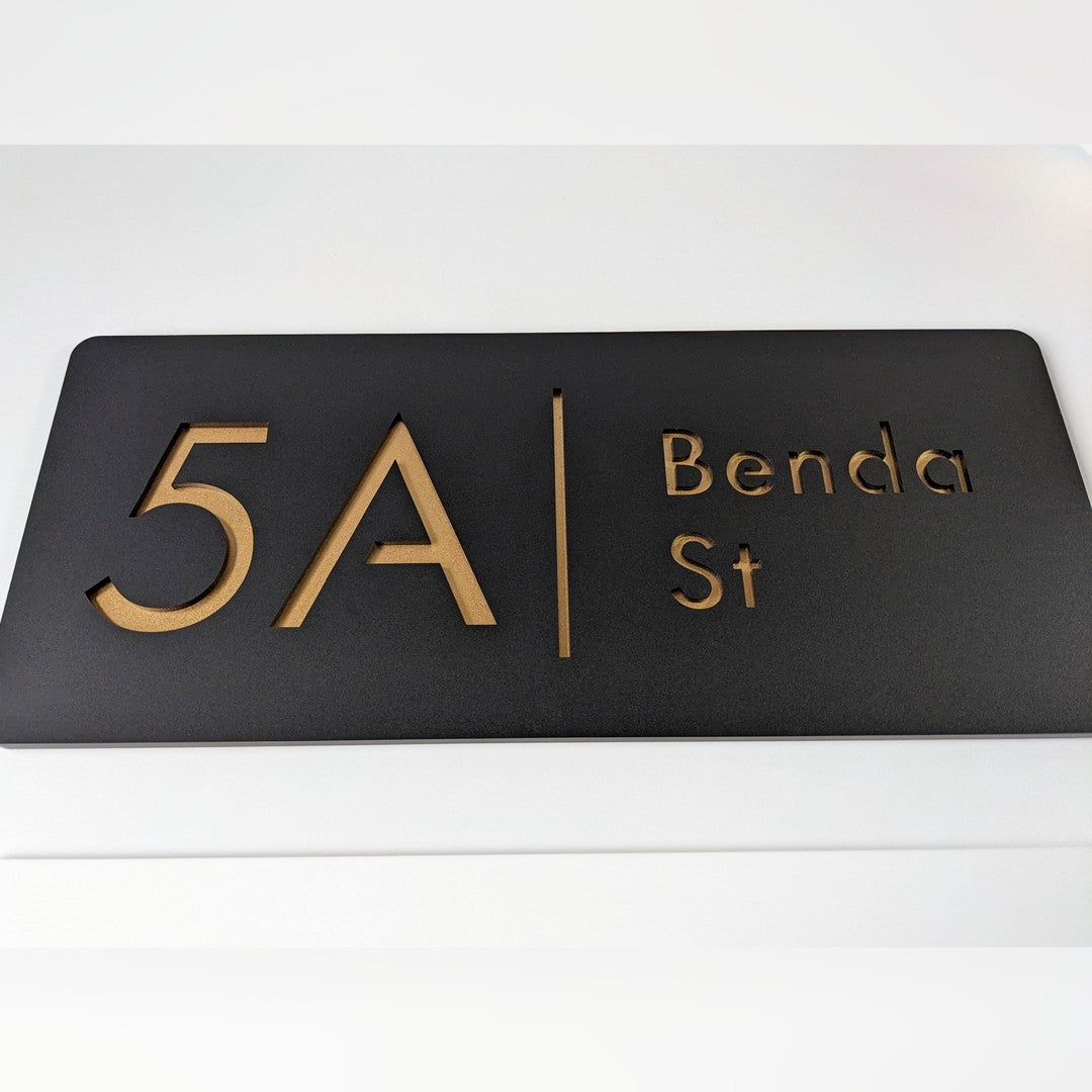 Acrylic house address sign – black panel with cut-out copper-gold house number 5A, divider line and Benda St lettering