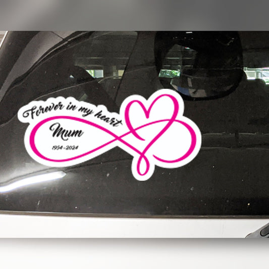 Memorial car decal – pink infinity heart with Forever in my heart, Mum and 1954-2024 in black script on a car window