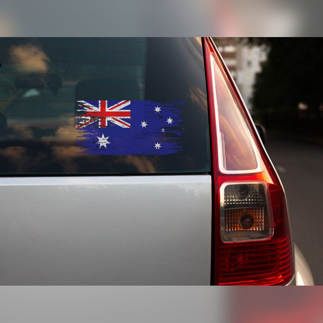 Distressed Australian flag decal – worn-look flag on the rear window of a silver hatchback