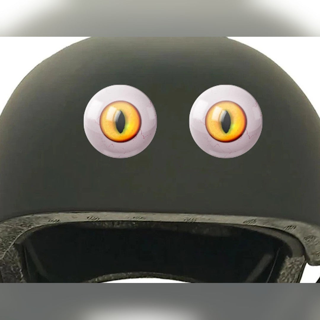 Eyeball eye stickers – pair of yellow cat-style eyes applied on a dark green helmet