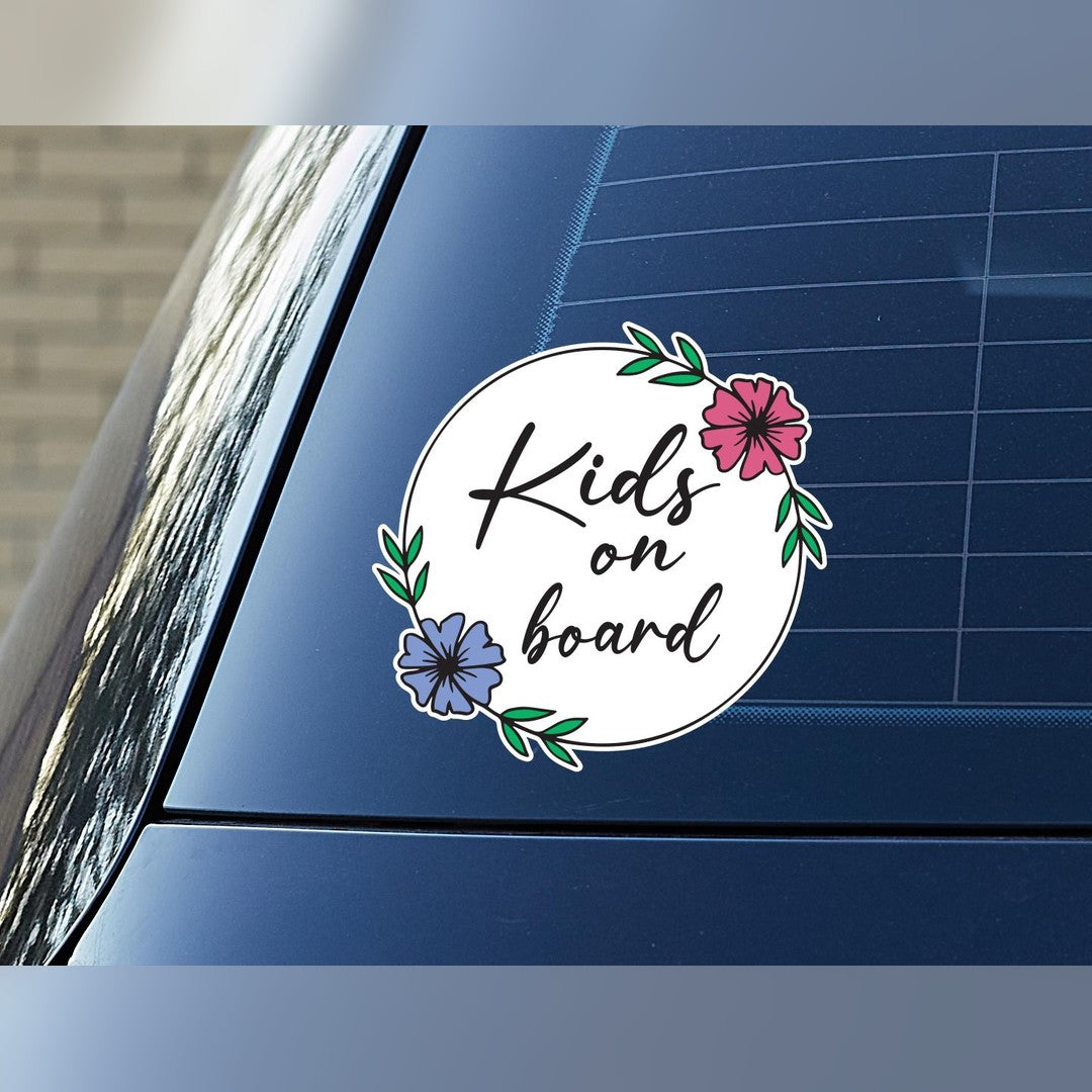 Floral wreath Baby on Board decal – round sticker reading Kids on board with pink and blue flowers on a car window