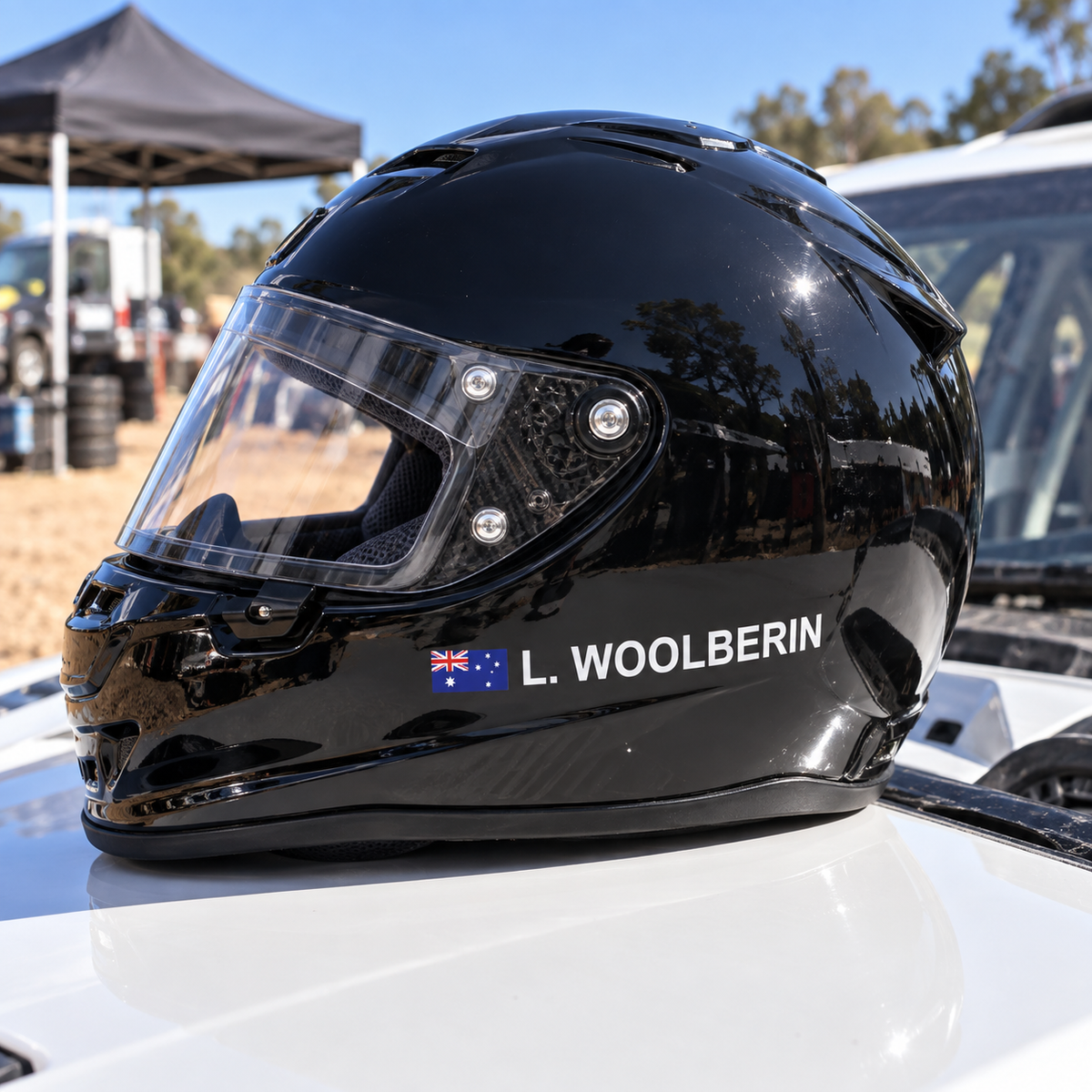 Australian flag driver name sticker on a black rally helmet