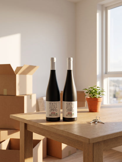 New Pad wine label in colour – two labelled bottles on a table with moving boxes and house keys