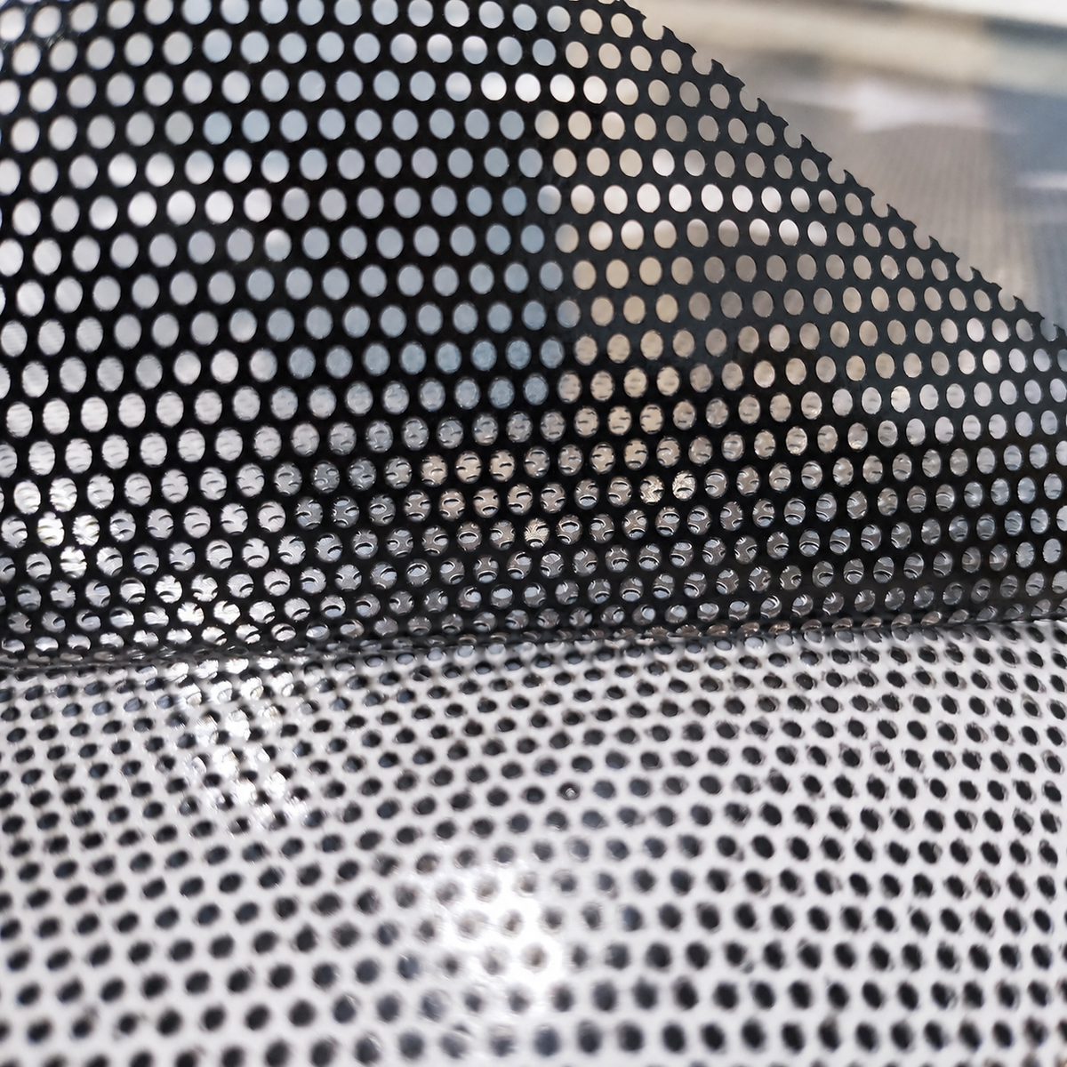 Close-up detail of printed perforated one way vision window film texture