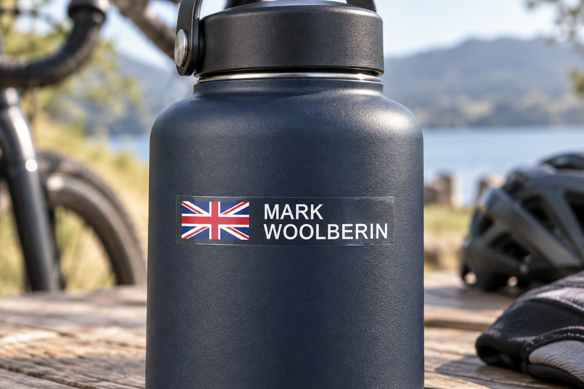 Option 4 block capital flag and name sticker on a navy drink bottle