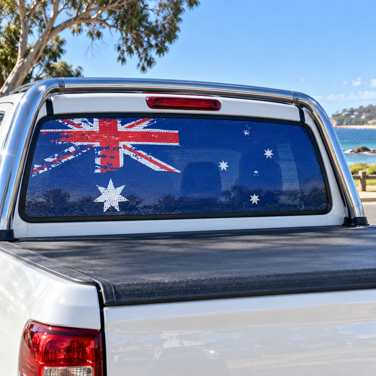 Distressed Australian flag one-way vision decal on a white dual-cab ute rear window