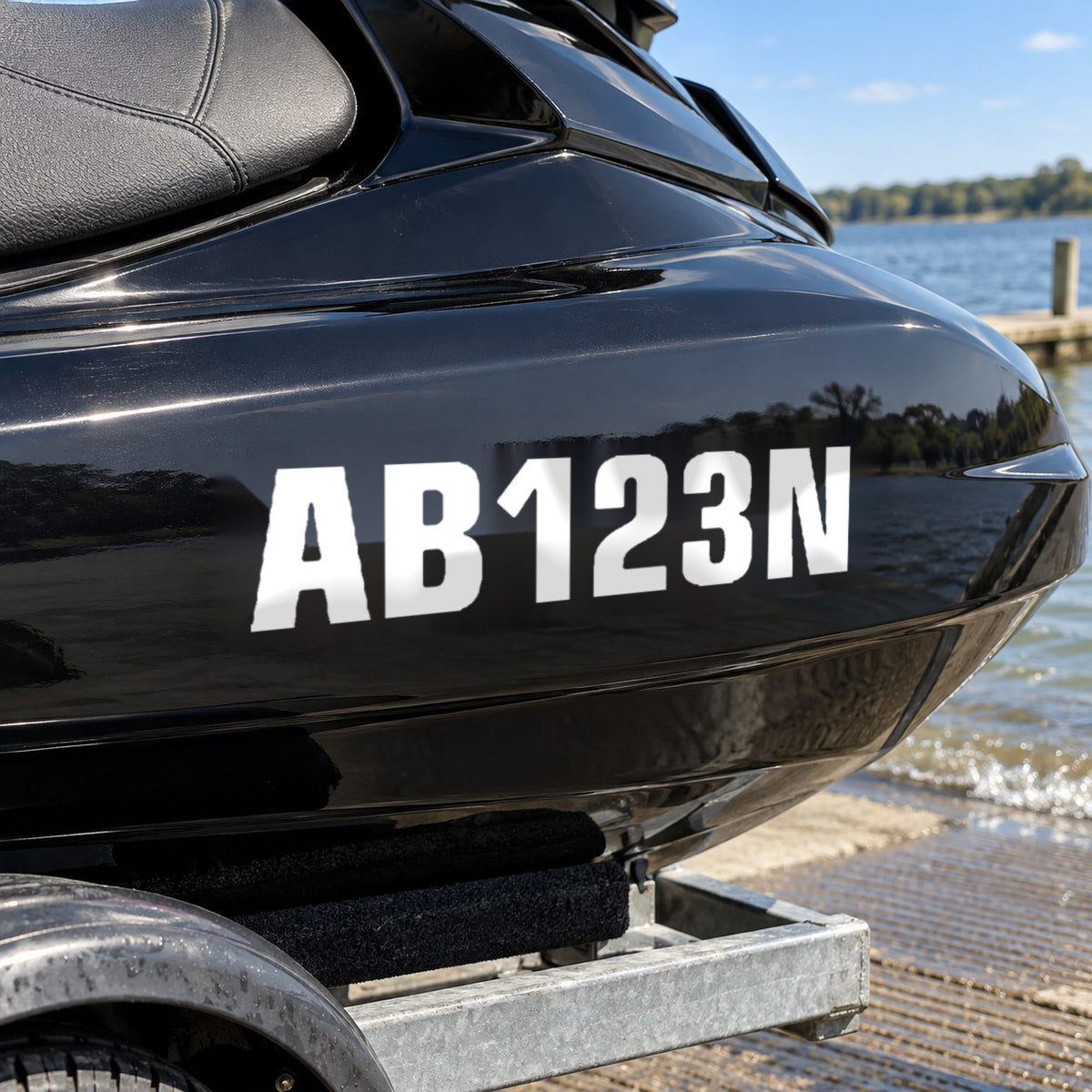 White AB123N registration decal on the side of a black jet ski.
