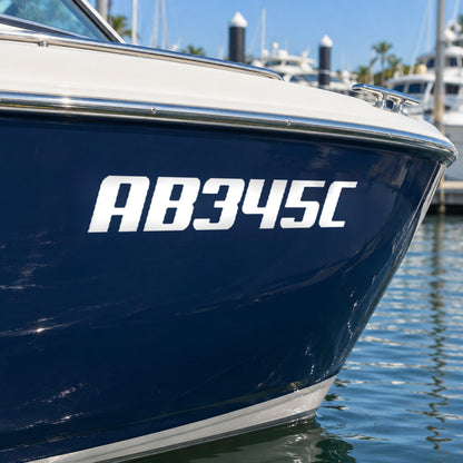 AB345C registration decal on the bow of a navy-hulled recreational boat.