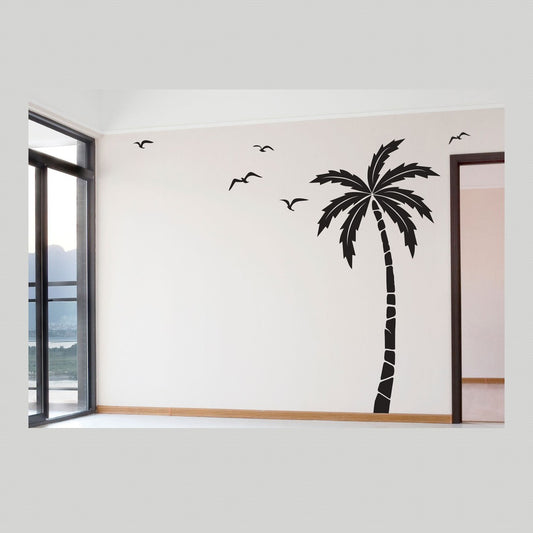 Wall decal – black palm tree and flying seagulls on a pale wall beside a window in an empty room