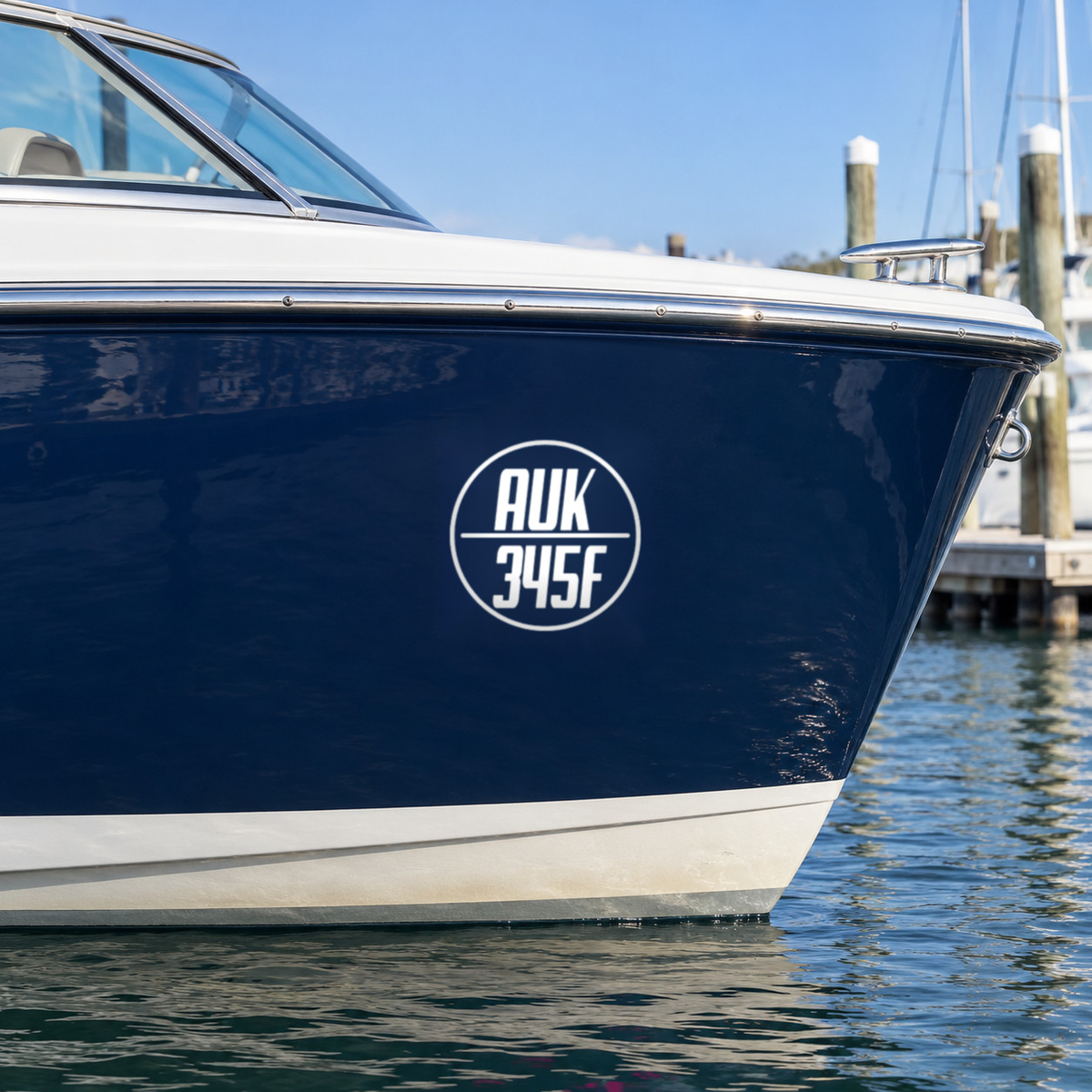 White round boat rego decal, design Option 1, on a navy boat hull