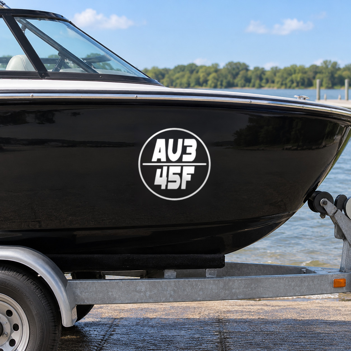 White round boat rego decal, design Option 4, on a black boat hull