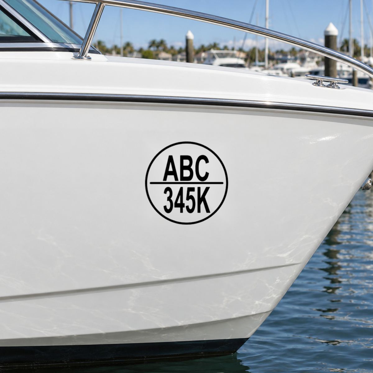 Black round boat rego decal, design Option 2, on a white boat hull